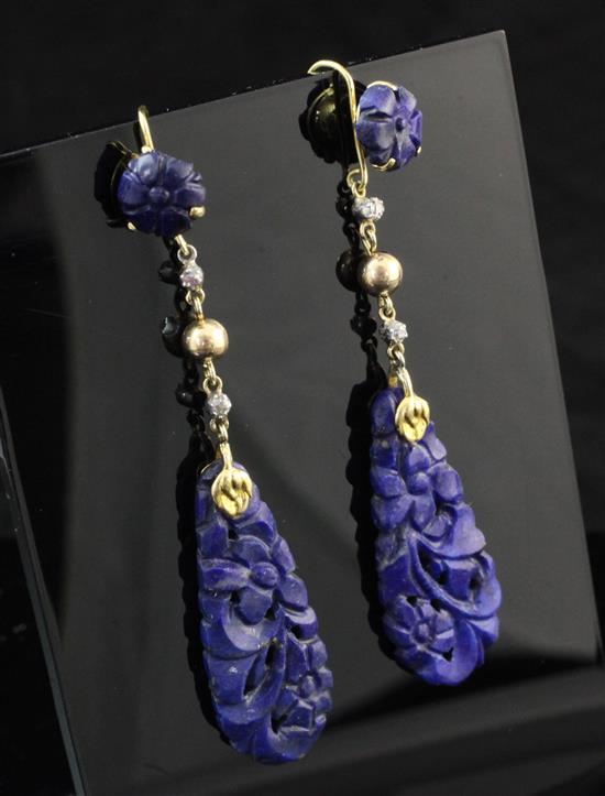 A pair of gold, diamond and carved lapis lazuli drop earrings, overall 2.75in.